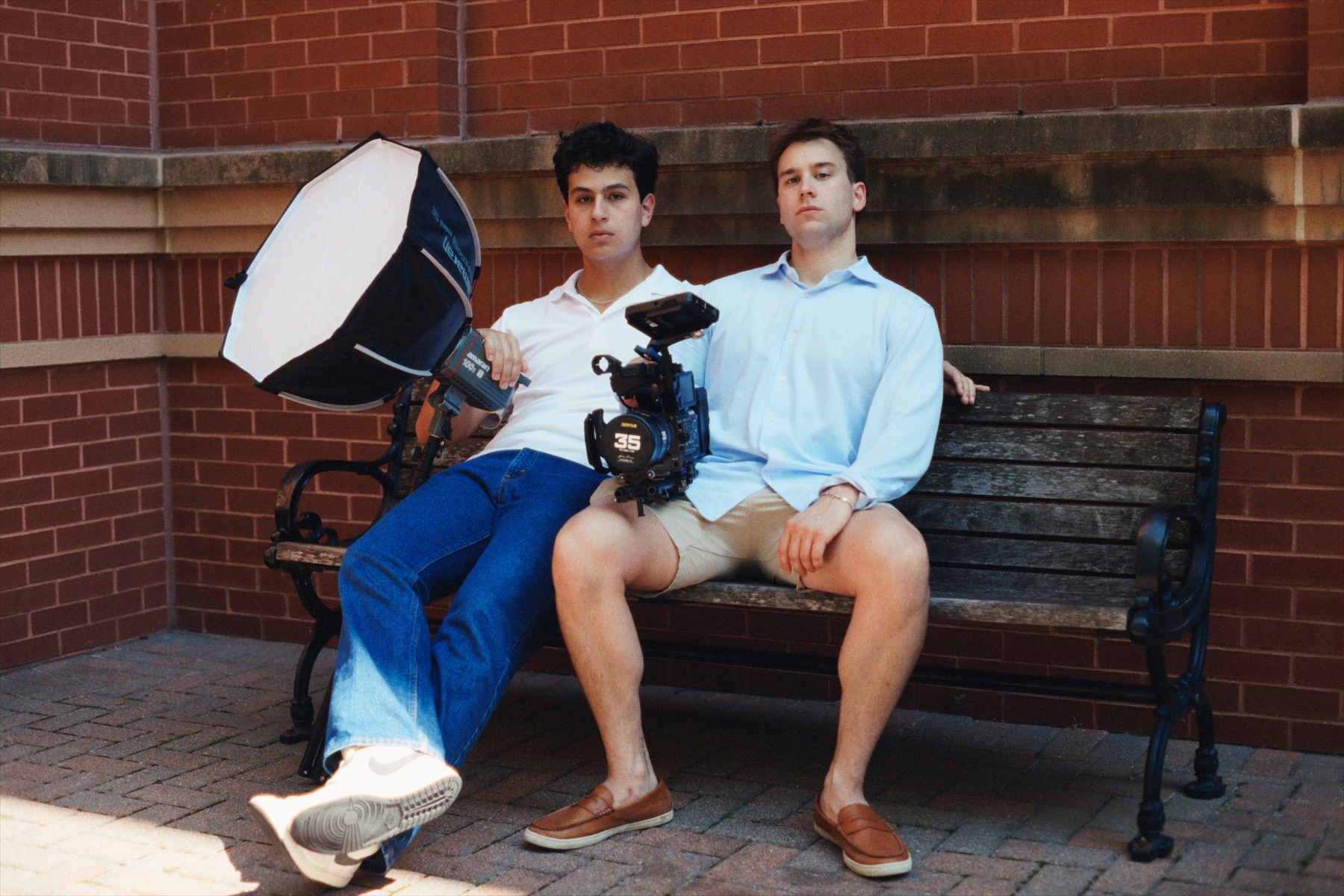 Graham Davidson and Dylan Spiegelman sitting with production gear